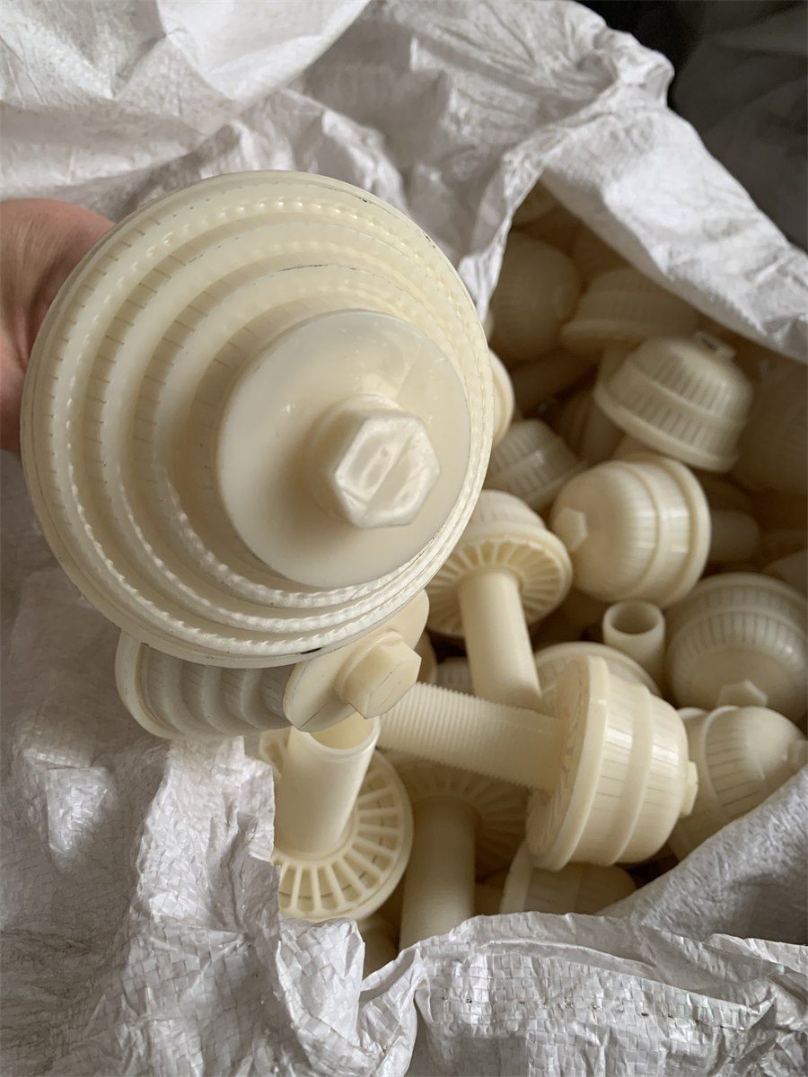 ABS filter nozzle held above its woven export bag