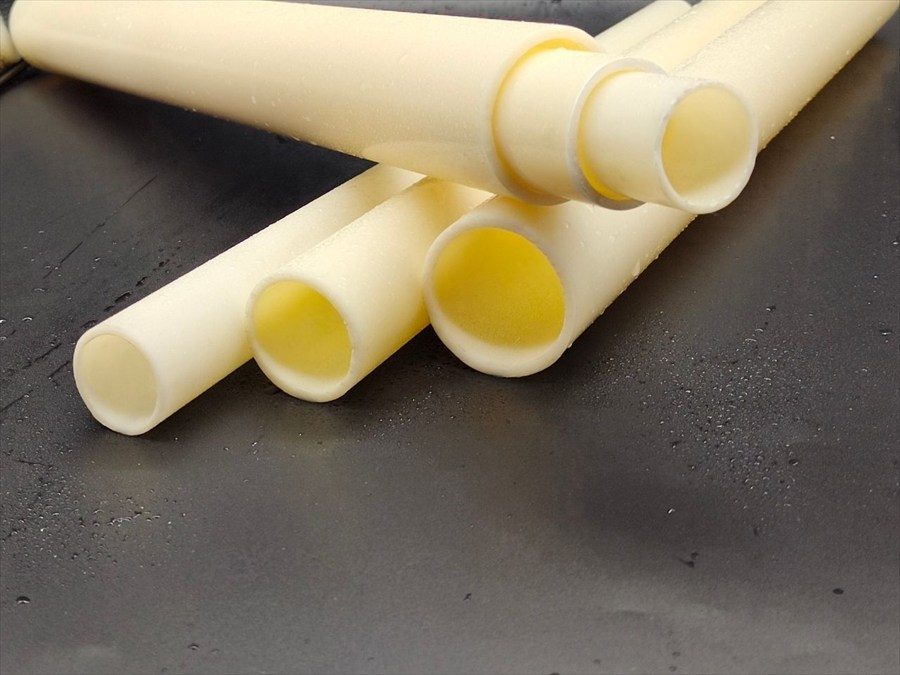 ABS socket pipe ends on a wet surface in close-up
