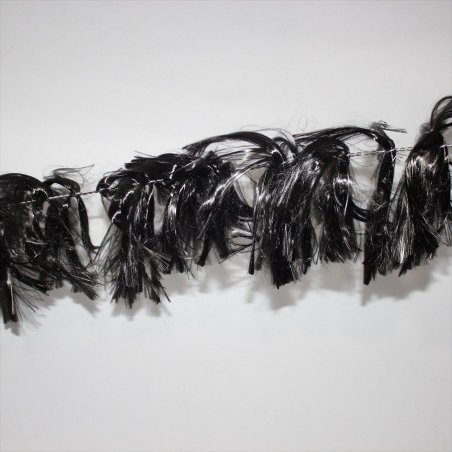 Carbon fiber water grass strand against a white background
