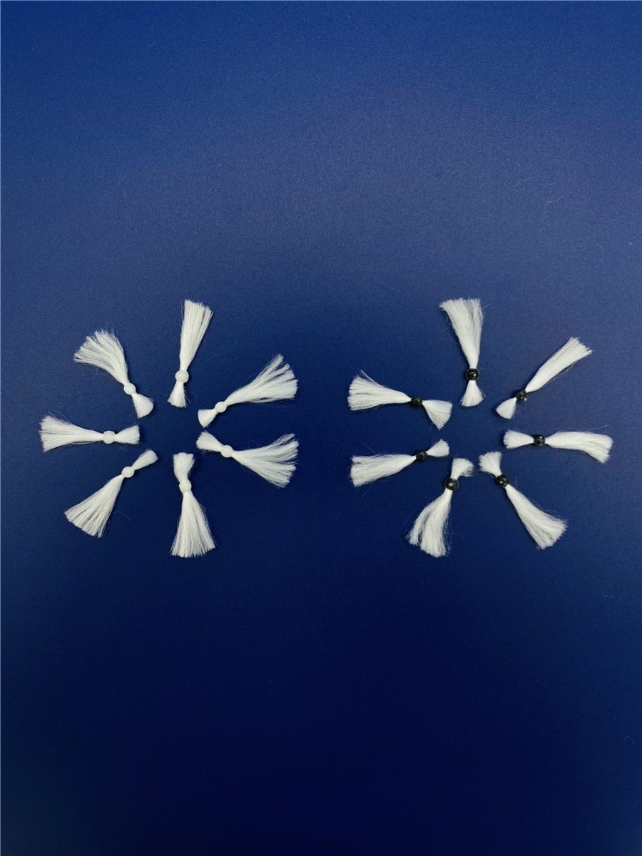 Comet fiber filter media — nucleus and tail arrangement