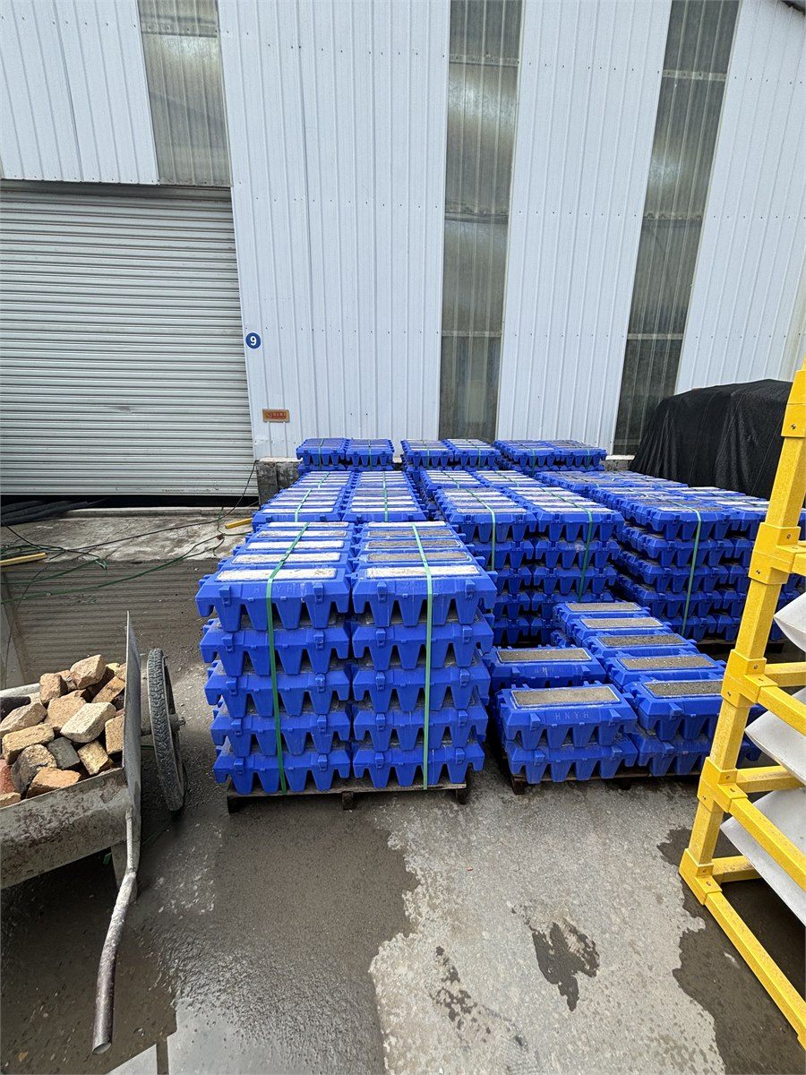 Pallets of blue filter bricks banded and ready for dispatch