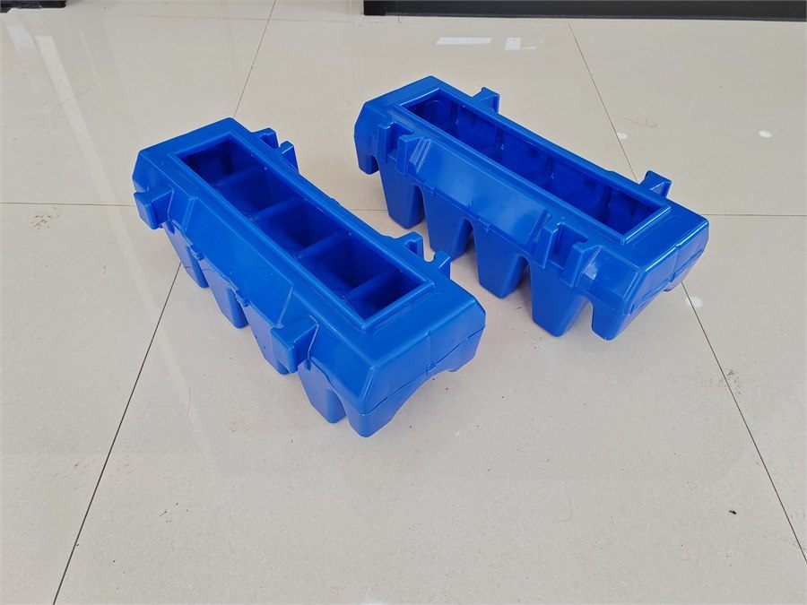 Two blue filter bricks on a tiled floor, three-quarter view