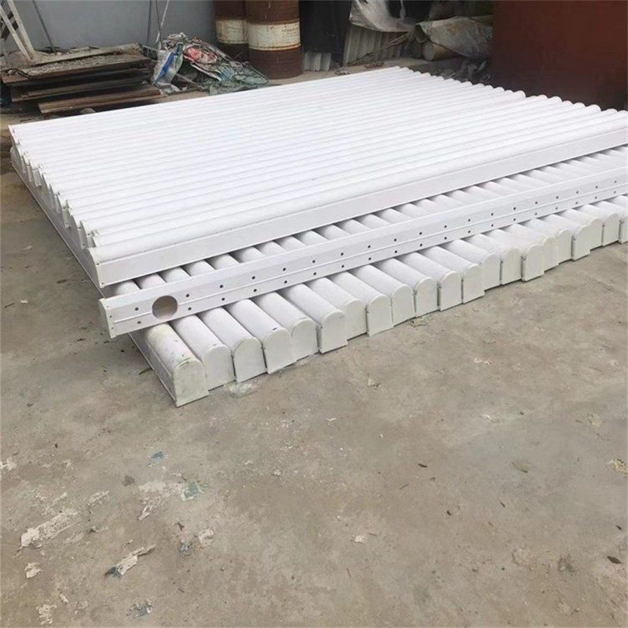 Rows of white bread pipes laid out at the factory