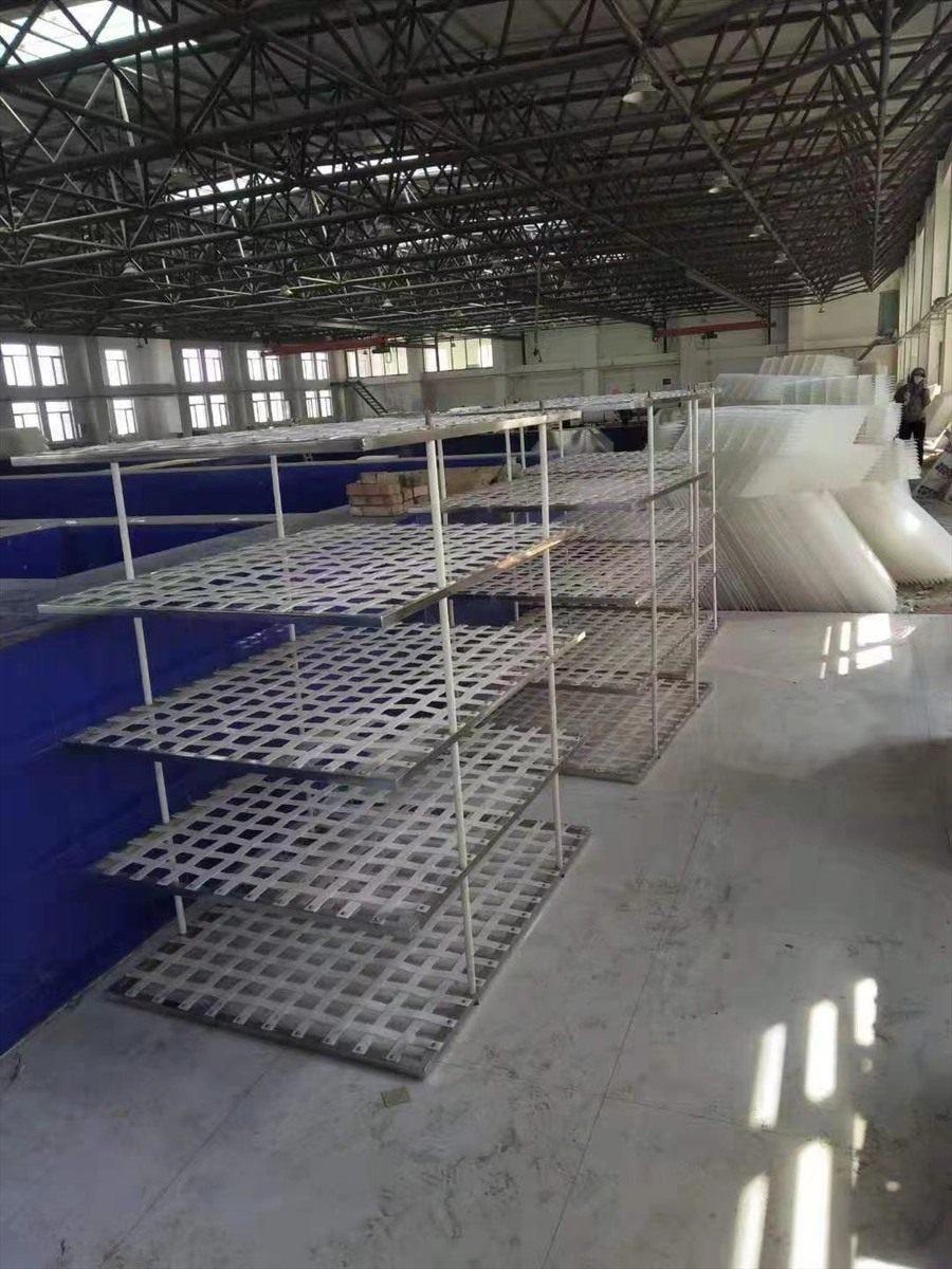 Rows of flocculation grid panels on factory shelving