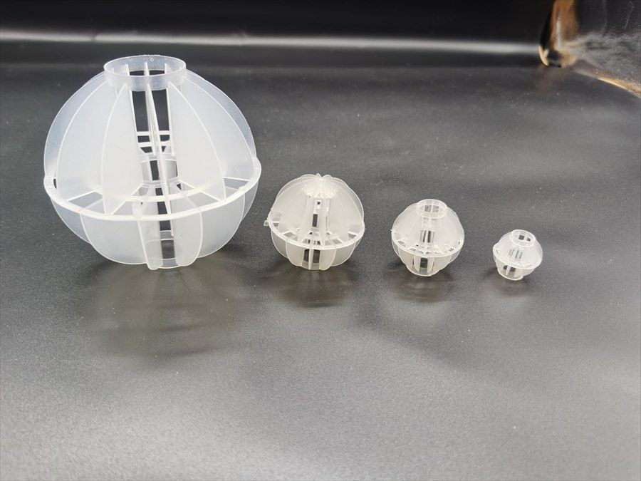 Four multi-faceted hollow ball sizes compared