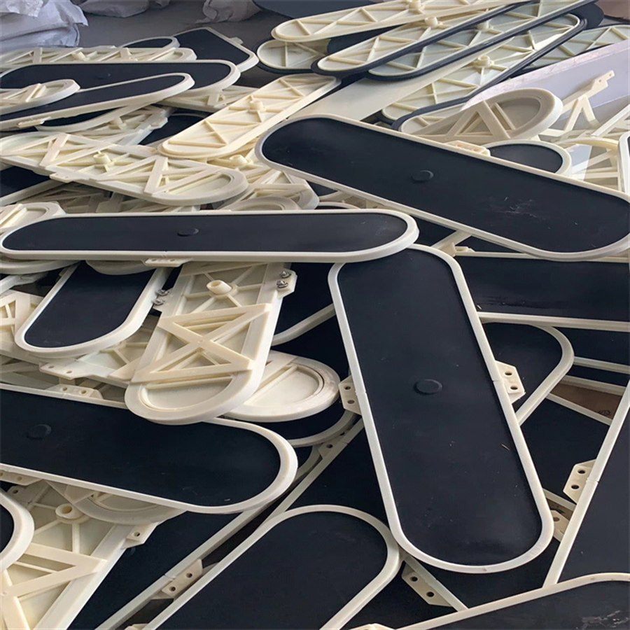 Plate aerators stacked at the factory, membrane and ribbed sides visible