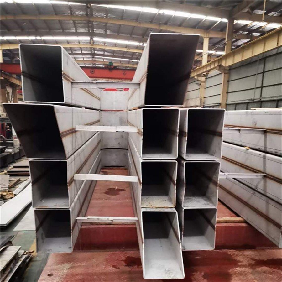 Stainless steel collection troughs stacked at the factory