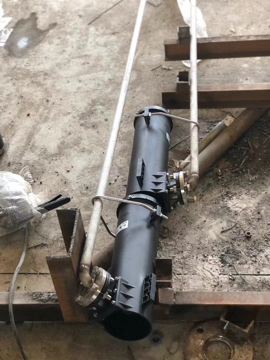 Vortex aerator clamped to its riser pipe with the air connection flanged